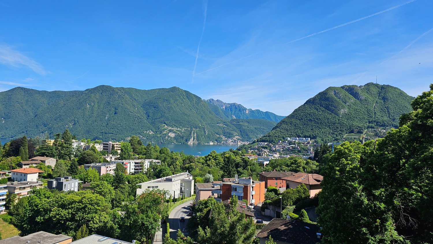 Residential area, mountains, lake, blue sky