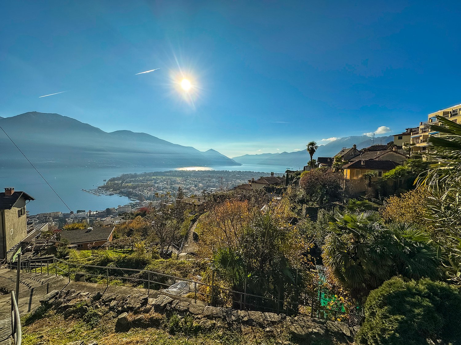 hillside view, houses, mountains, lake, clear sky, sun