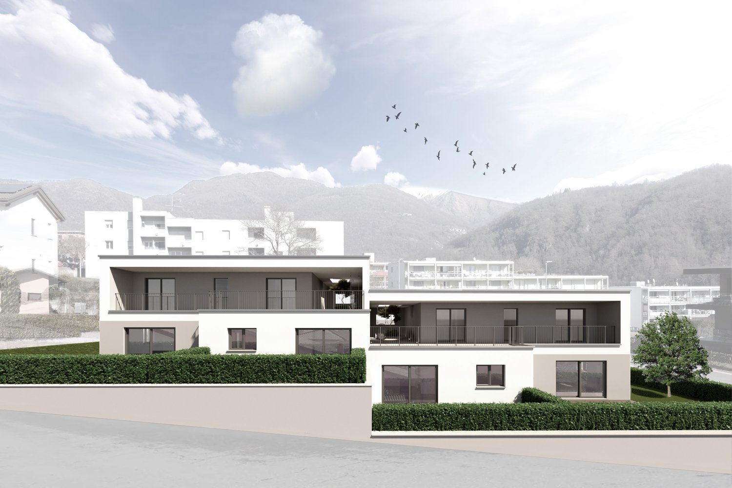 Two-story building, white exterior, raised ground floor, multiple balconies, mountain view