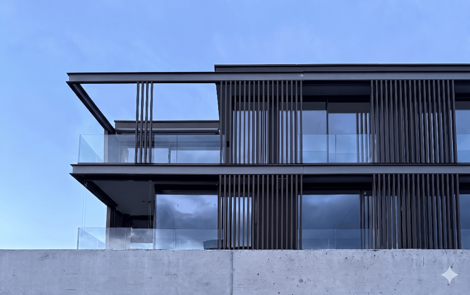 modern design, glass walls, balcony, raised ground floor