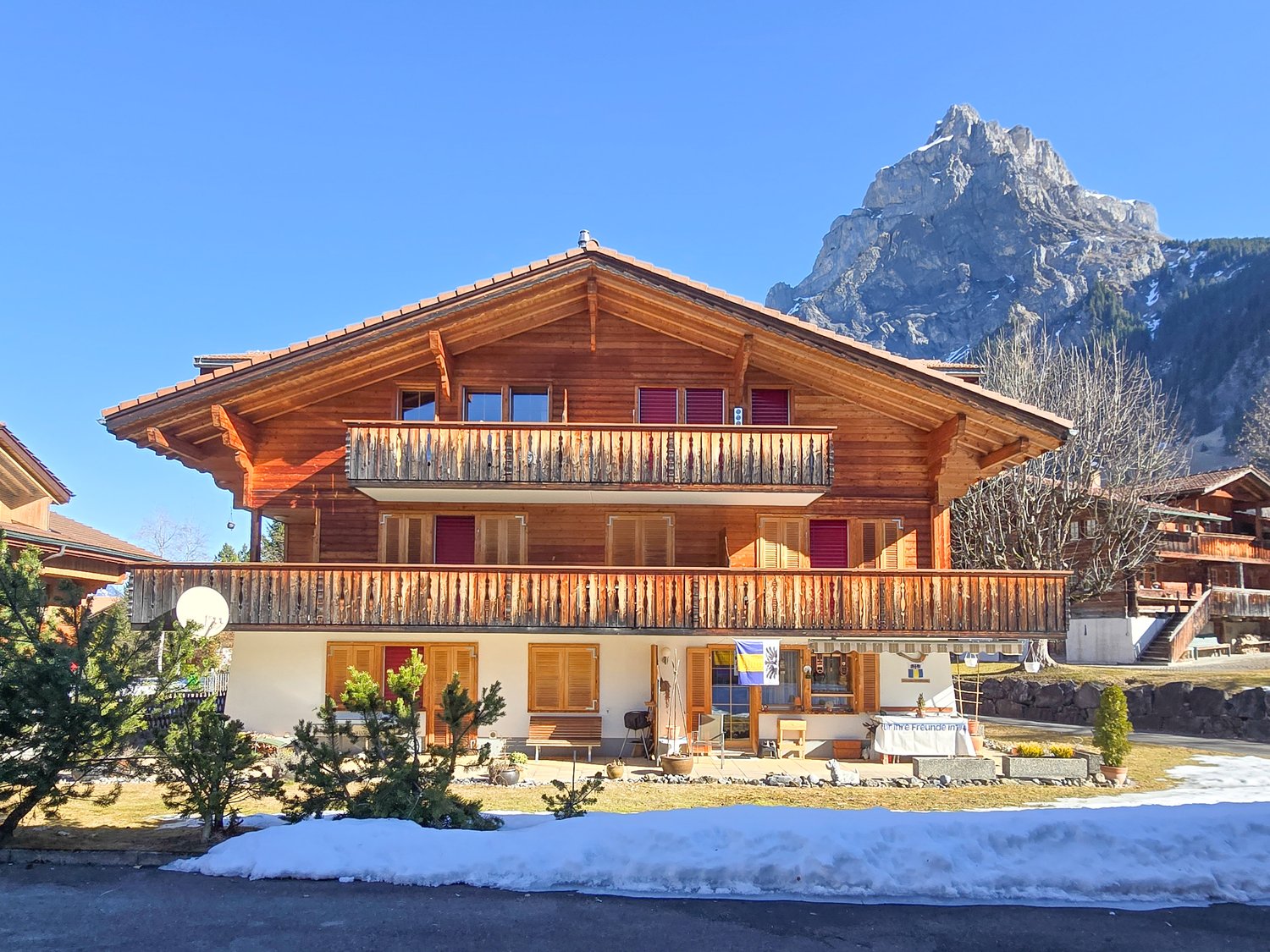 wooden chalet style house, 3 stories, balcony, mountain view