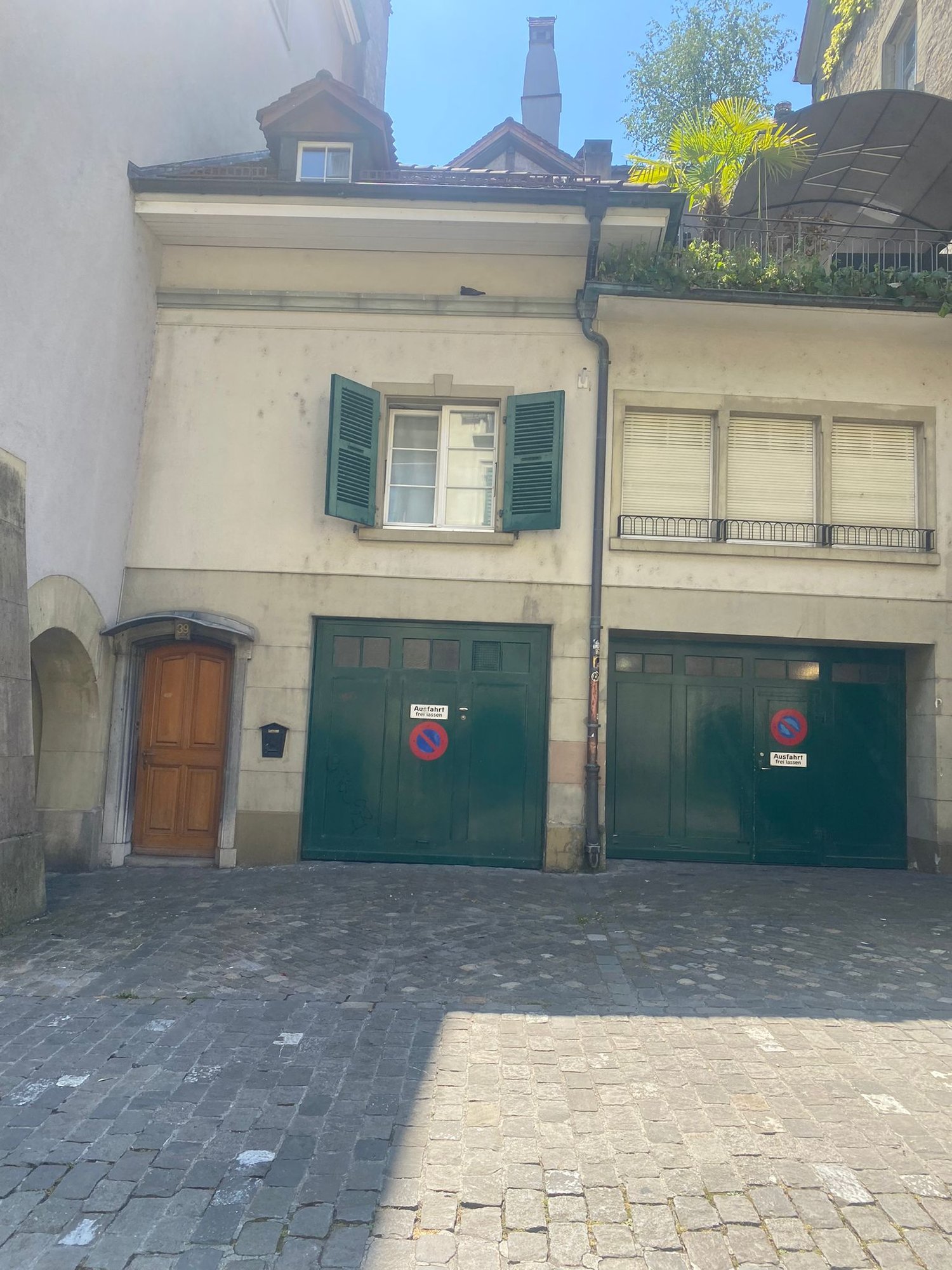 Two garages in front of a building