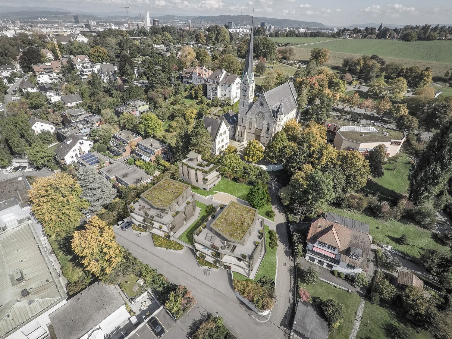 Multiple residential buildings, green roofs, garden areas, church, large open field, roads