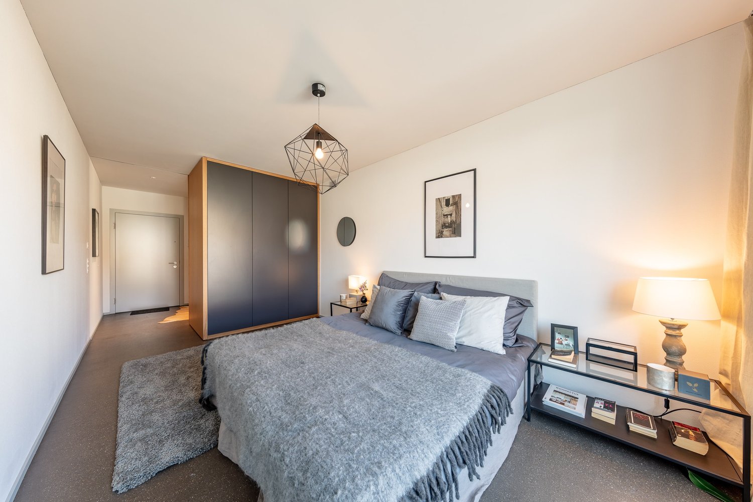 bedroom with a bed, carpet, a nightstand, a closet, and lamps