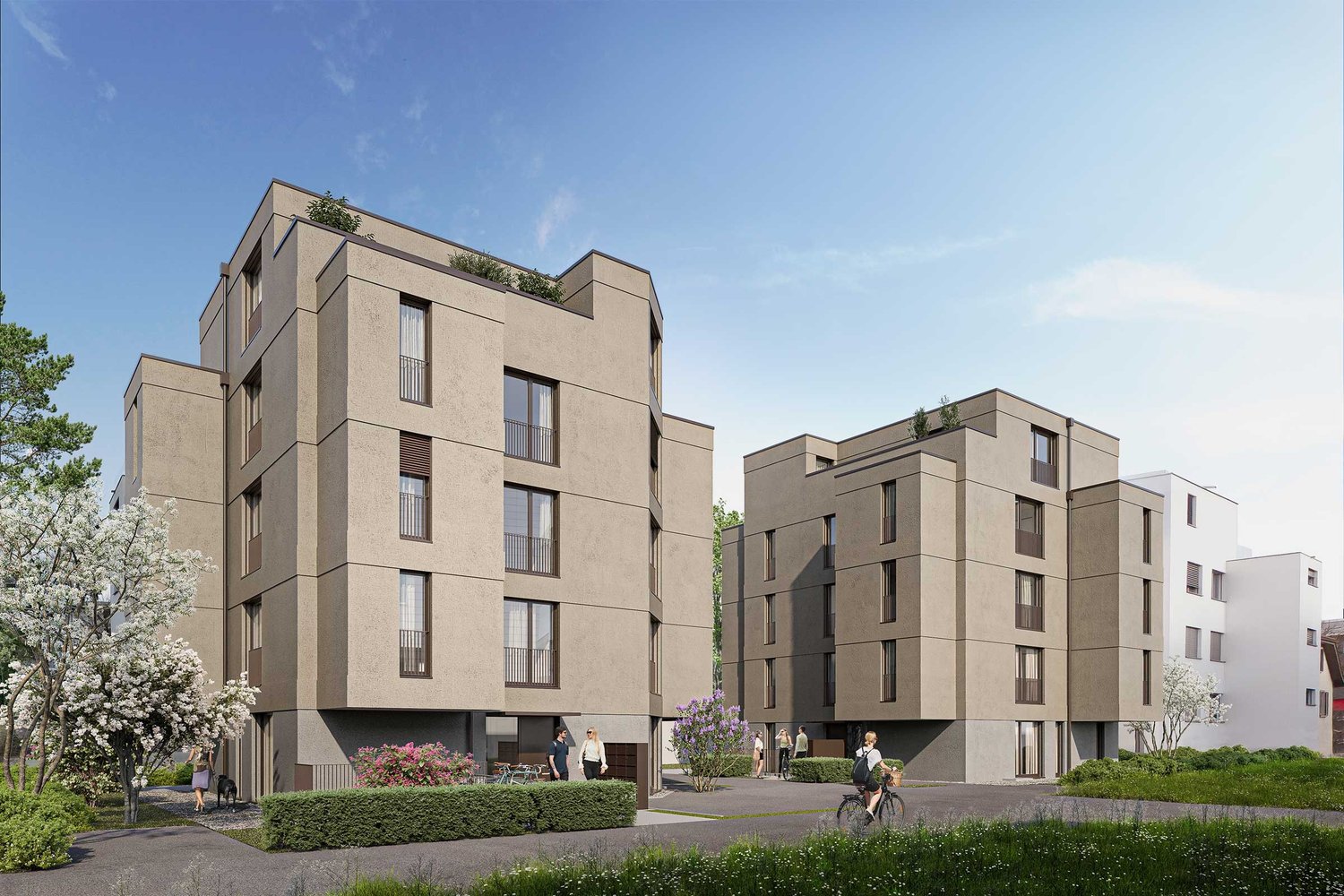 Multi-story apartment building with modern, angular design. The building has balconies on some units and is surrounded by landscaping with trees and greenery.