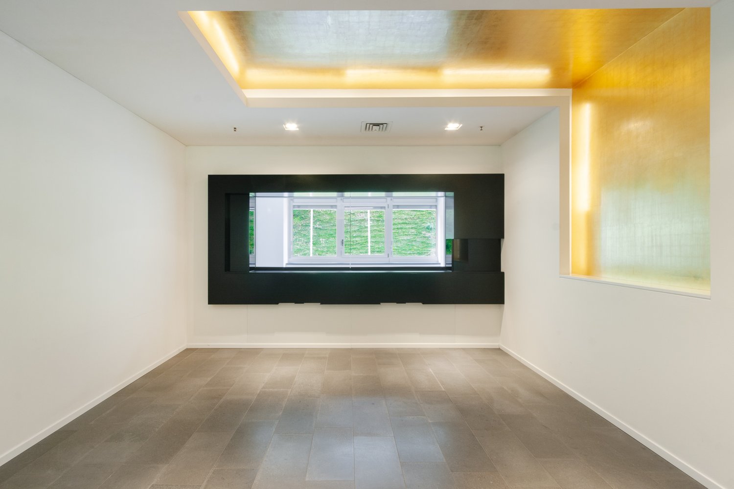 empty room, white walls, wooden floor, large window, yellow accent wall
