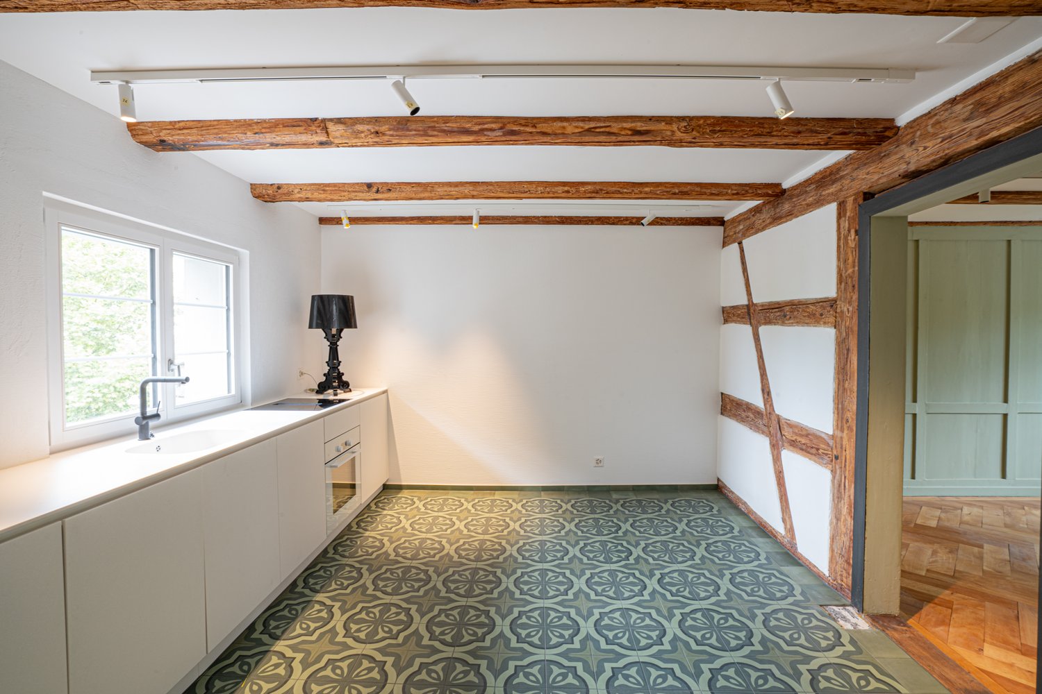 kitchen, wooden beams, window, floor tiles, kitchen counter, oven, lamp, sink