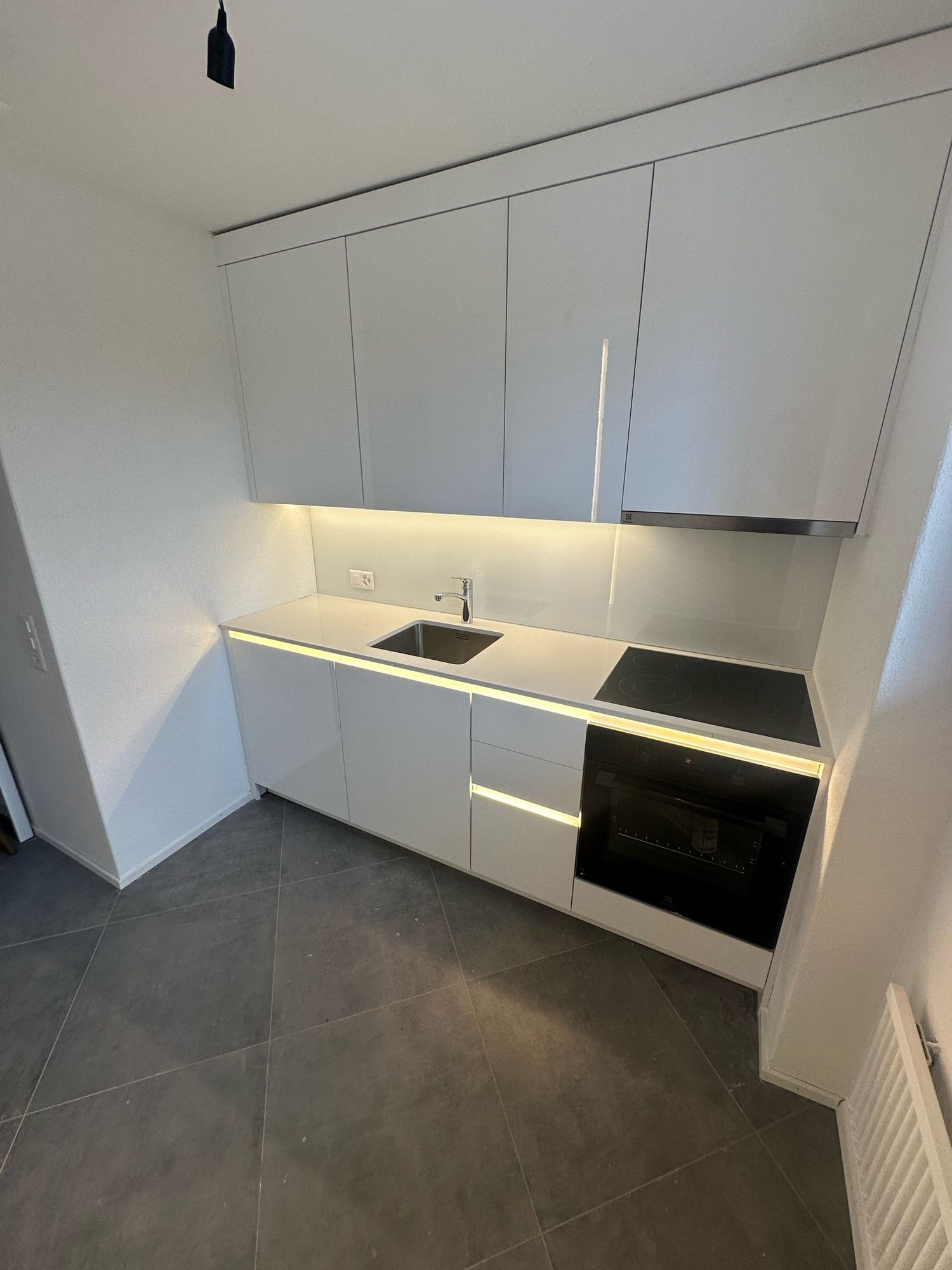 white cabinets, tile floor, kitchen island, sink, stove, oven, modern, spacious