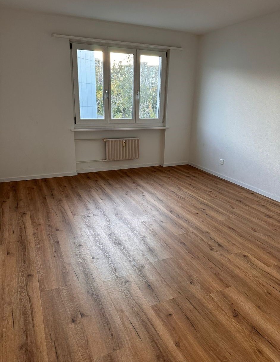 empty room, large window, wooden floors, white walls, heating under window