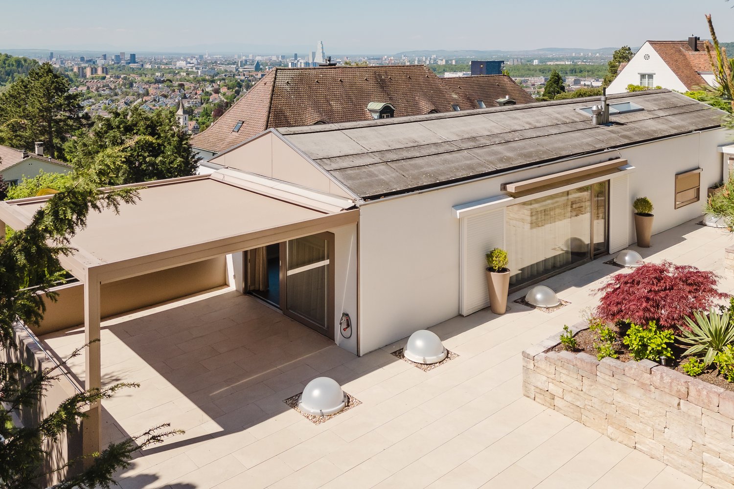 detached house, white facade, gray roof, tiled terrace, carport, garden area, multiple plants