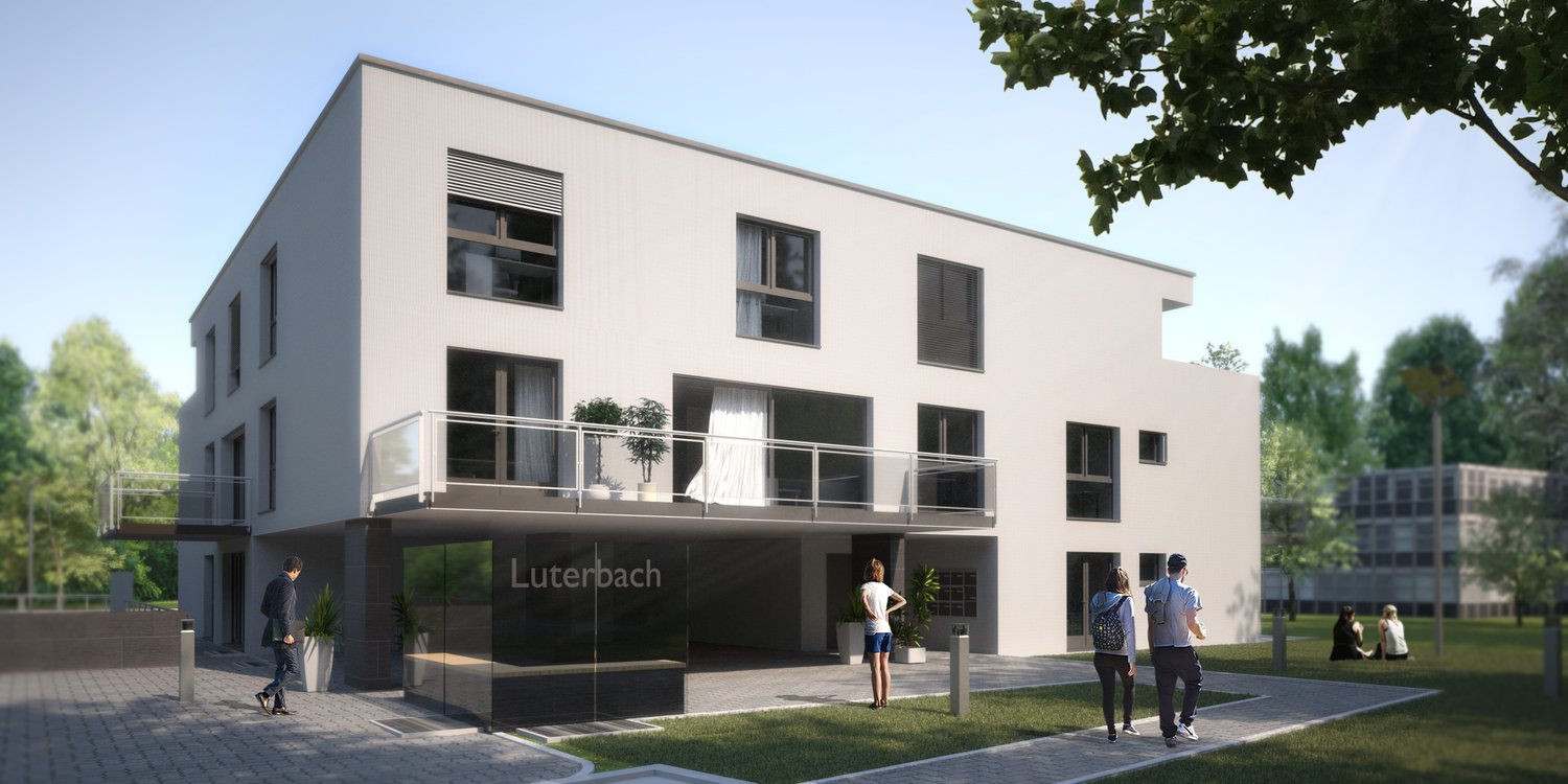 A modern, multi-story building with a clean, minimalist design. The building has large windows and balconies, and the exterior is painted in a light, neutral color. There are people walking in the surrounding green space in front of the building.