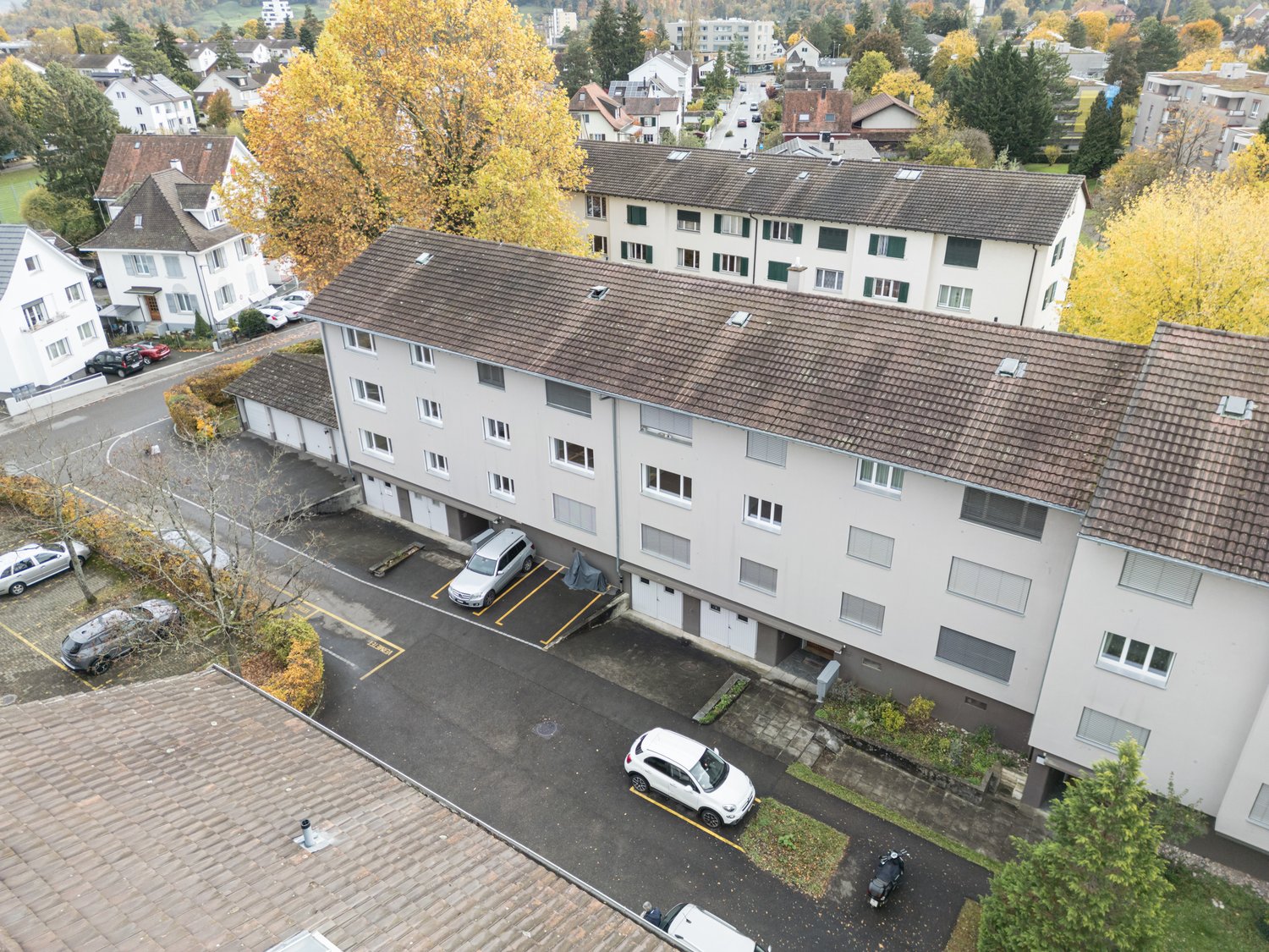 Multistory residential building with underground garages and parking spaces