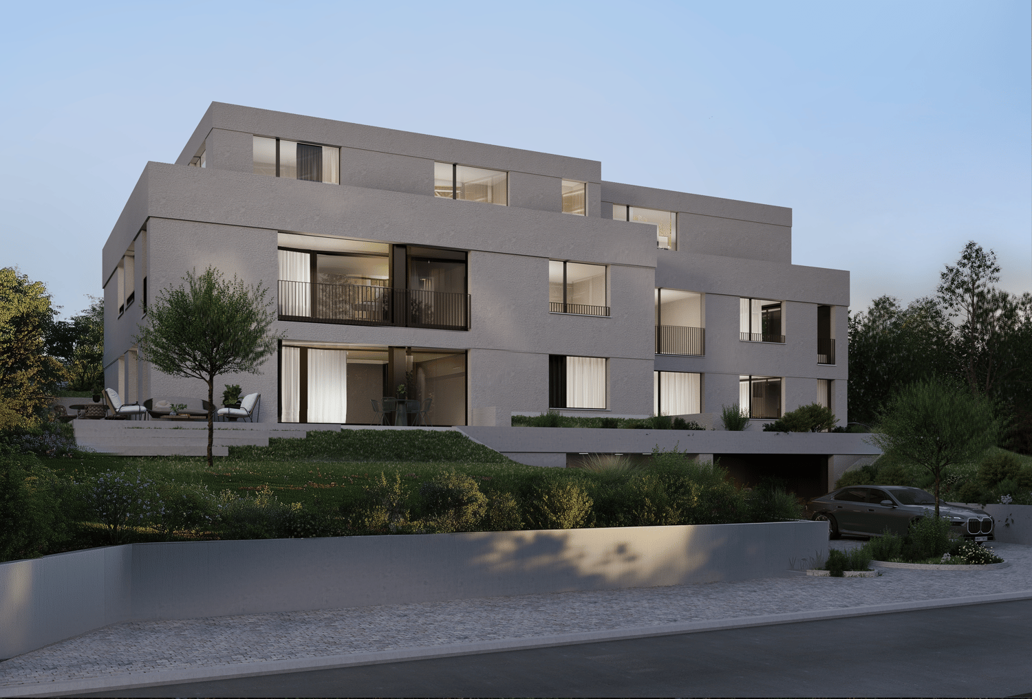 multi-story residential building, concrete walls, large windows, several balconies, garden in front, parking place