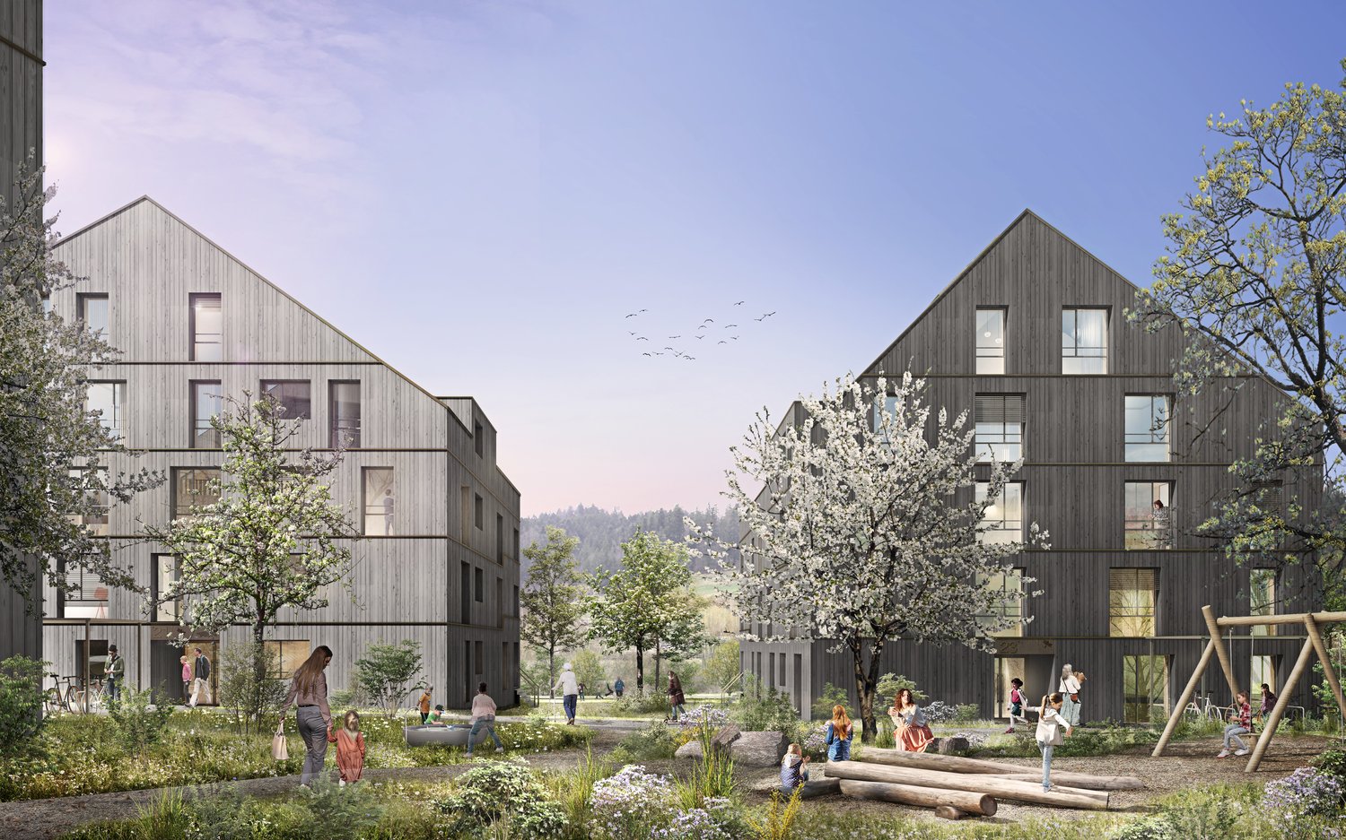 Two modern apartment buildings with wooden facades, surrounded by a lush green park with trees, flowers, and a playground.