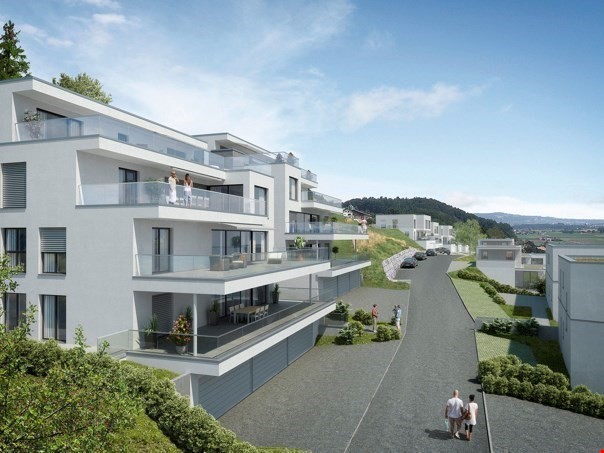 multi-story apartment building, white exterior, glass balconies, paved driveway, lush greenery