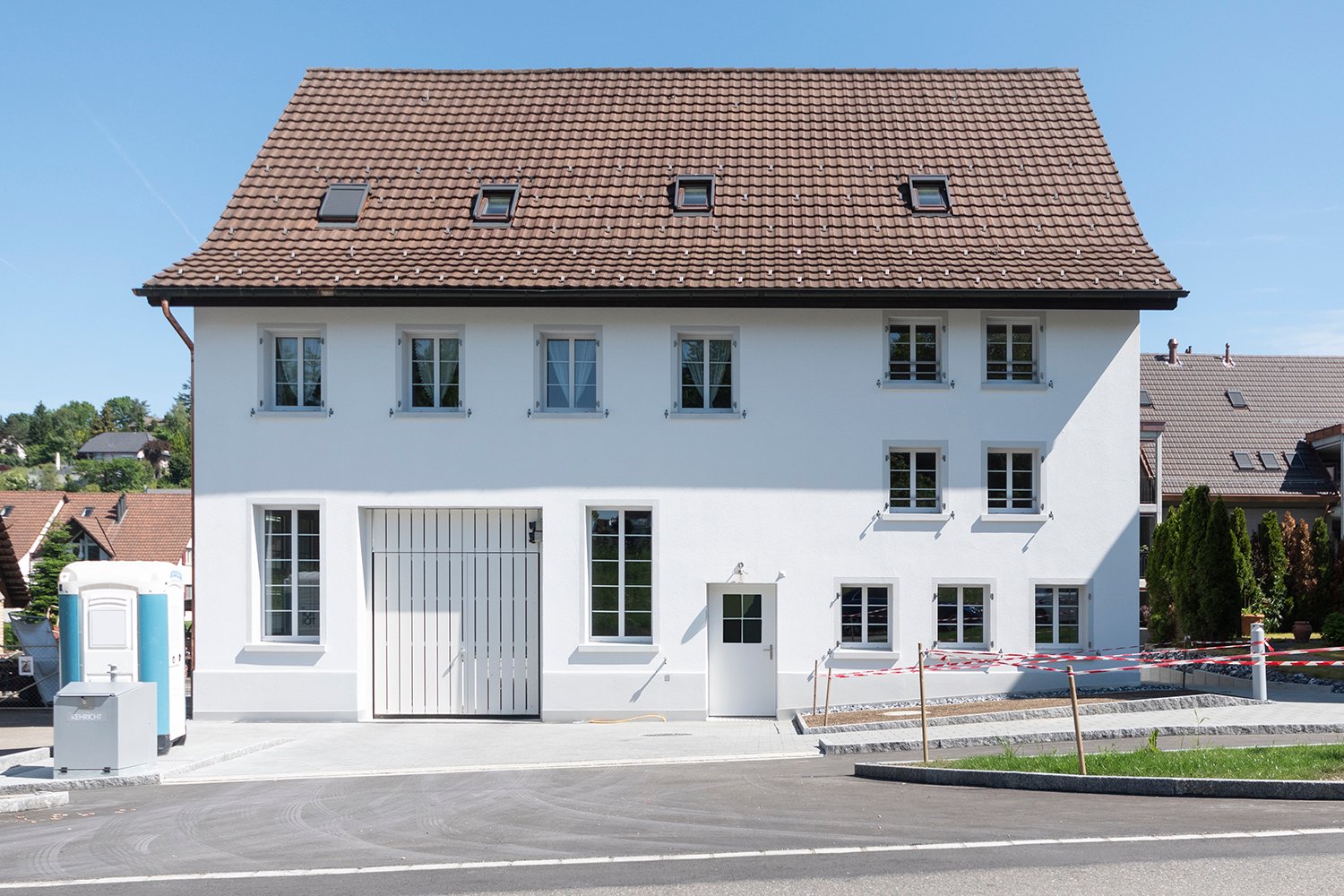2 story house, white paint, brown roof, garage, large windows