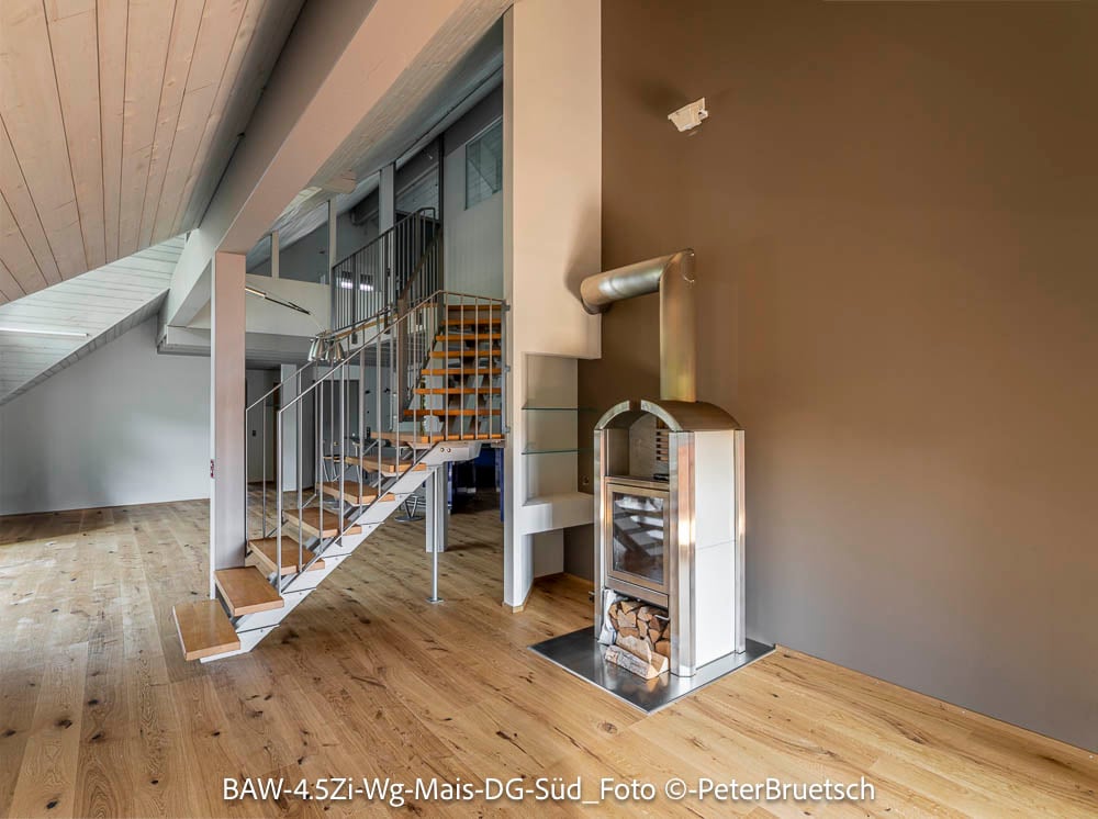 wooden floor, wall-mounted fireplace, spiral staircase, steel railings