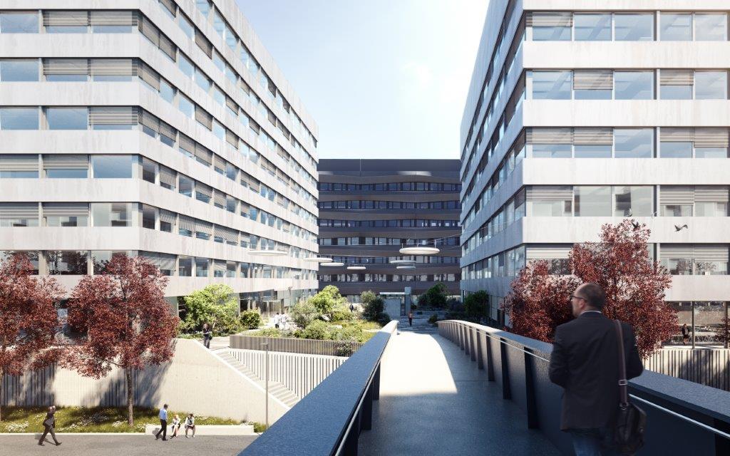 modern office building with glass facades, landscaped garden area, pathways connecting buildings, overhead lighting fixtures