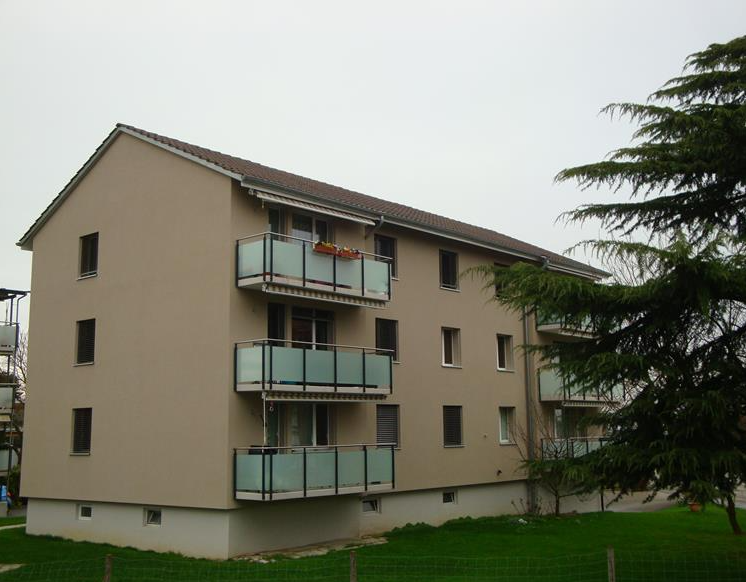 3-story building, balcony, multiple windows, glass railings