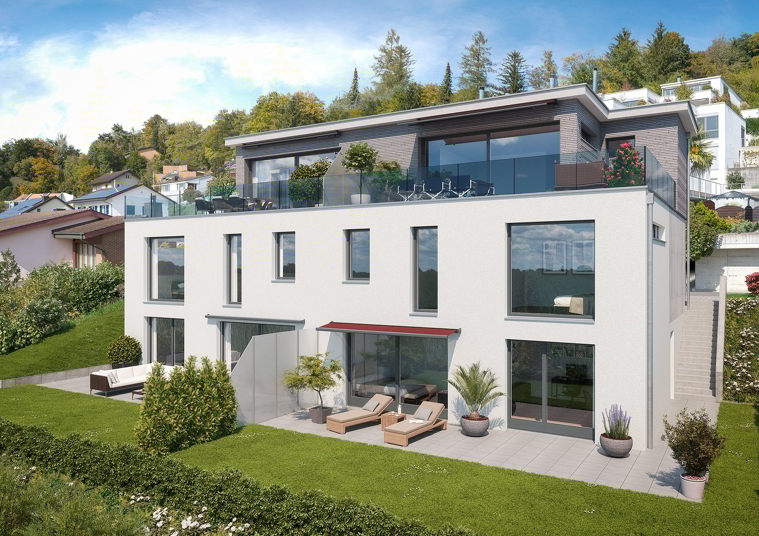 Modern two-story house with large windows, balcony, and outdoor seating area. The house is surrounded by lush greenery and trees.