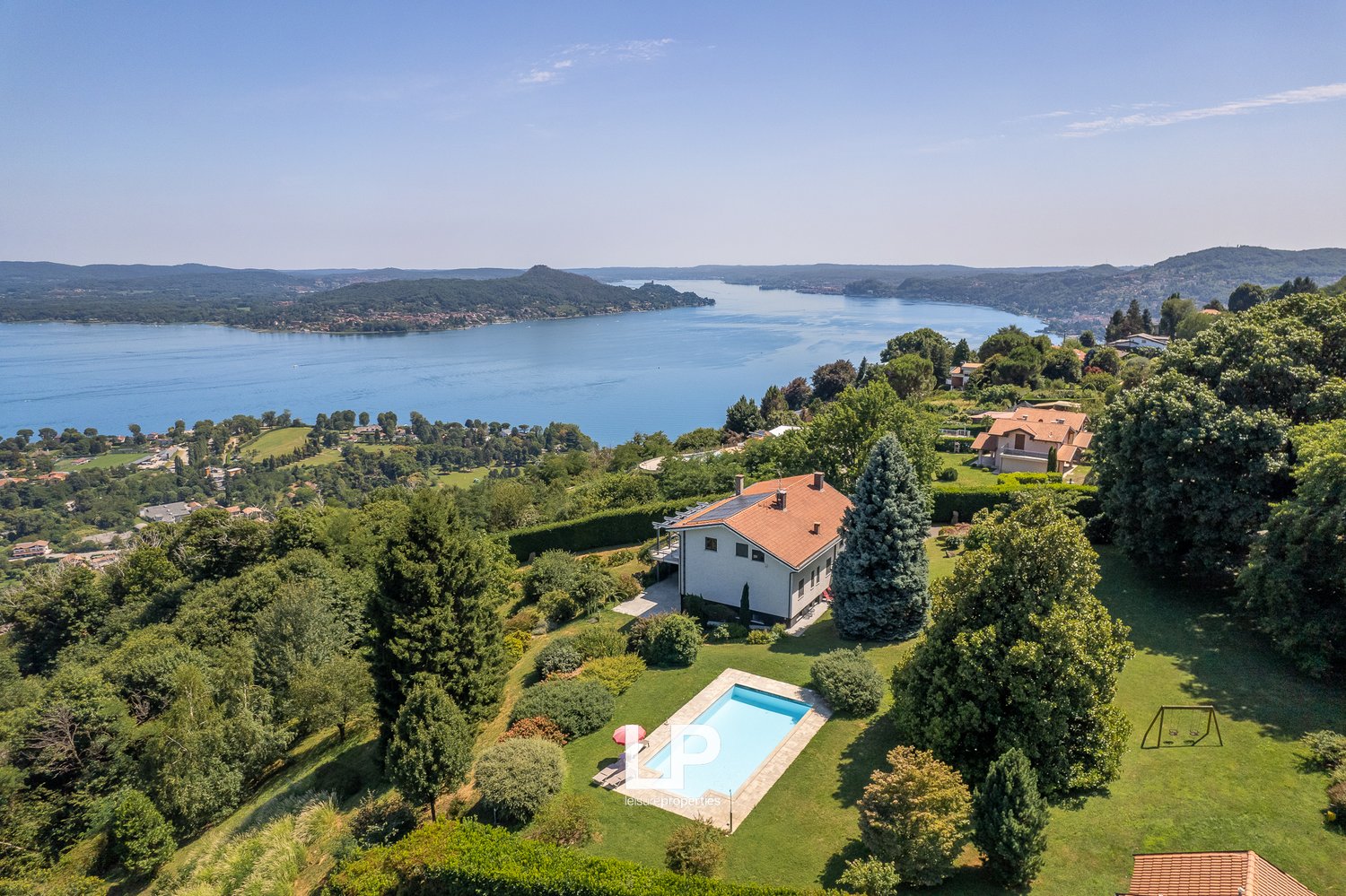 2 story house, surrounded by garden, with swimming pool, view over lake and mountains