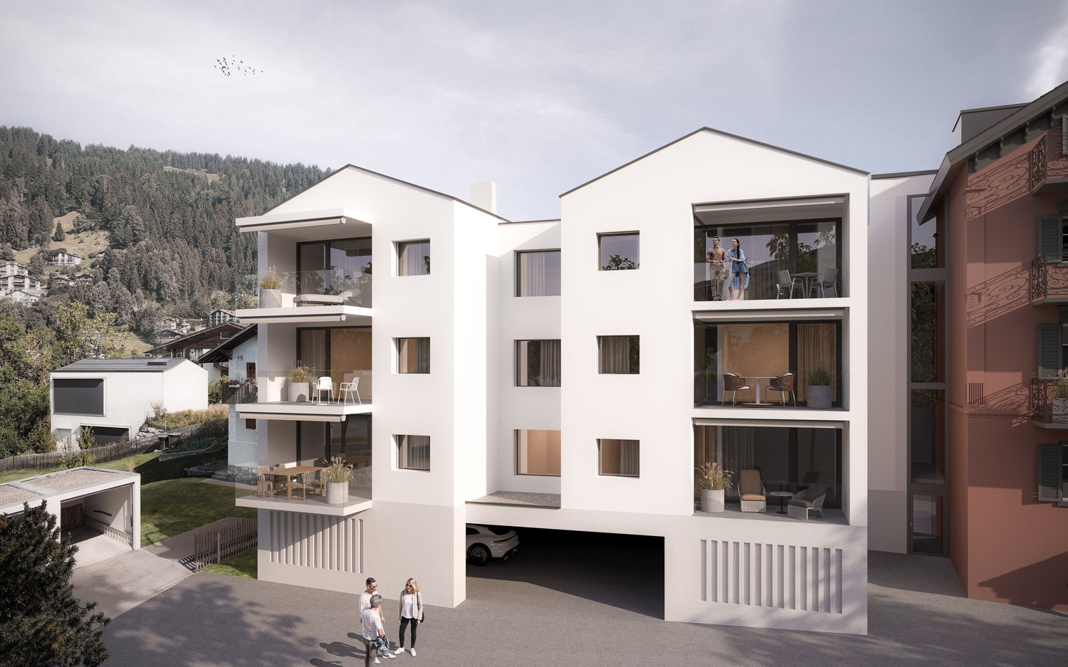 modern building, raised ground floor, balconies, garage, surrounded by mountains