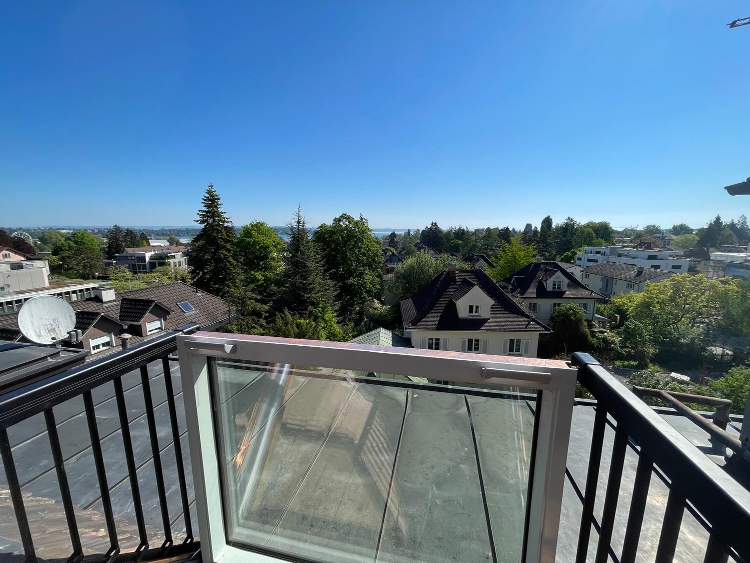 glass window, glass door, balcony railing, cityscape view, trees