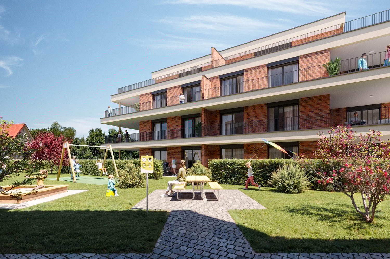 Multi-story brick building, multiple balconies, playground in front