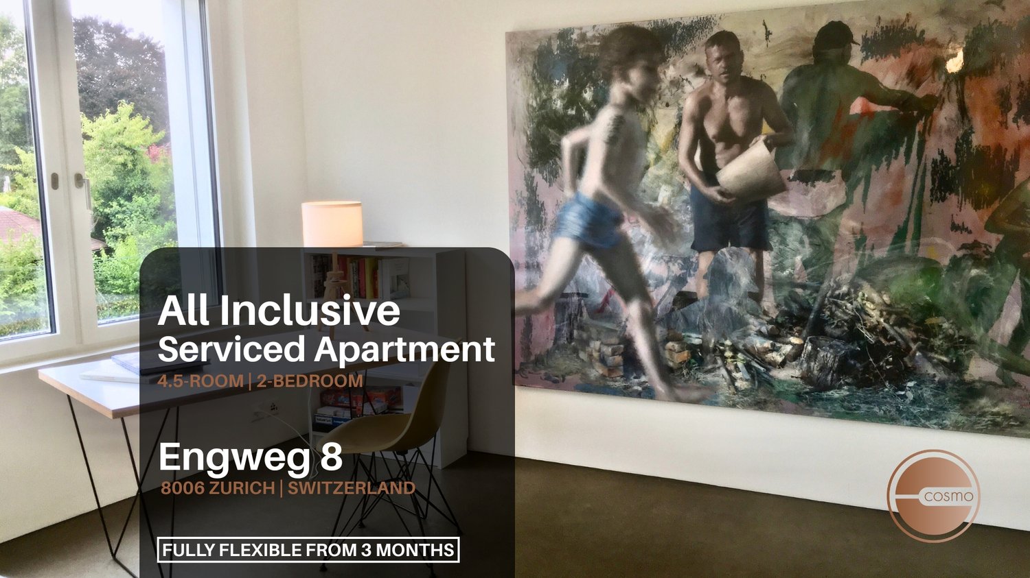 Living room with white walls, wooden desk, and bookshelves. Big wall art depicts three men. Window with views of trees.