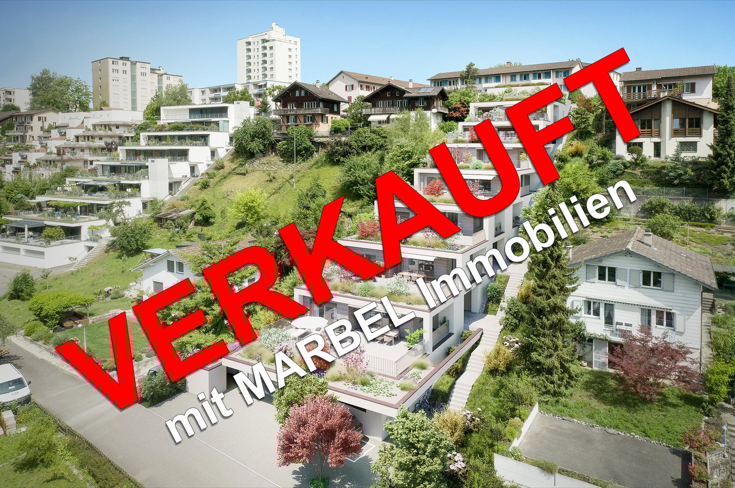 The image shows a residential area with a mix of high-rise apartment buildings and smaller, multi-story houses with balconies. The buildings are surrounded by lush greenery, including trees and landscaped gardens. There appear to be parking spaces availab