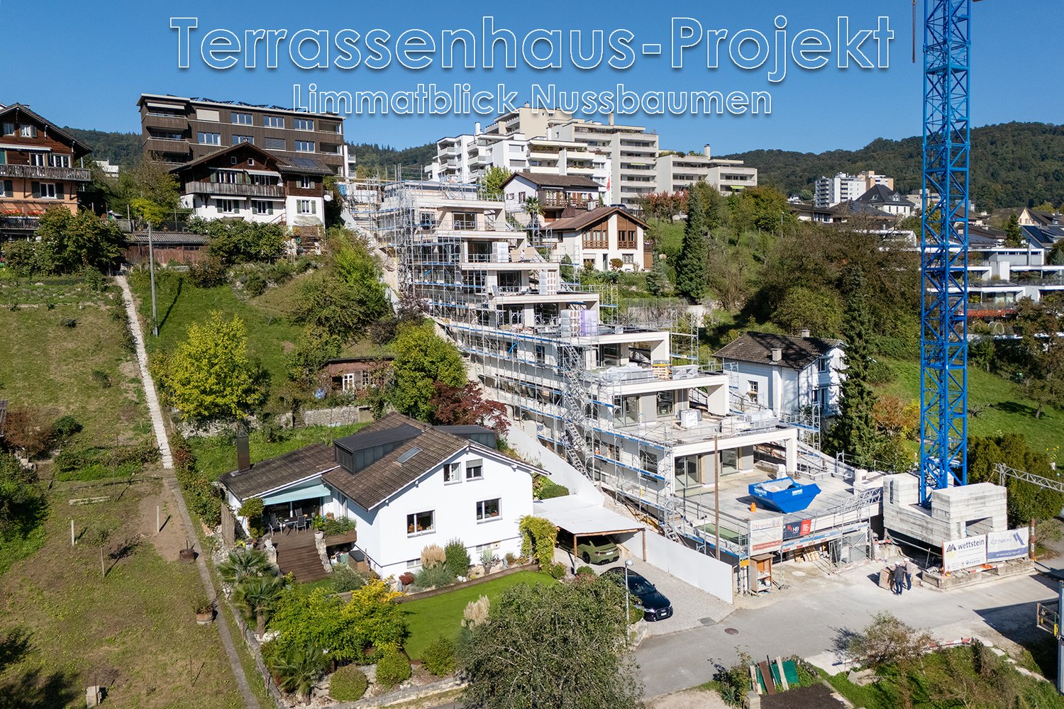 Construction site with several terraced houses under construction with some completed