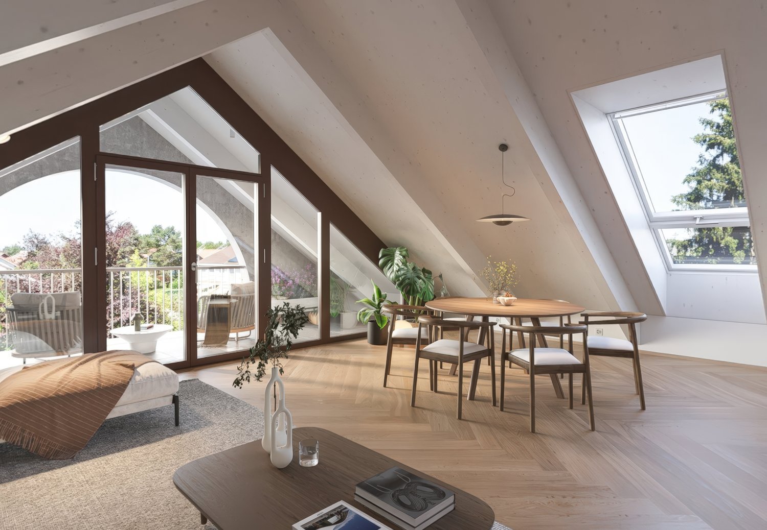 Spacious open-plan living and dining area with large windows and a balcony/terrace overlooking a scenic outdoor view. The room features a wooden dining table with chairs, a couch, and various potted plants and decor elements. The high ceilings and slanted