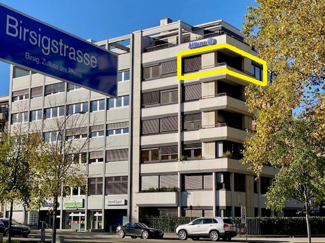 residential building, 6 floors, balconies, many windows, marked apartment